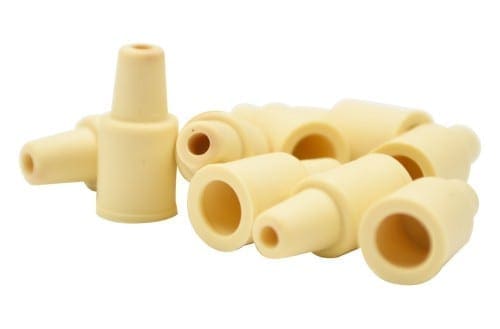 Beige rubber caps with tapered design for sealing small openings or parts.